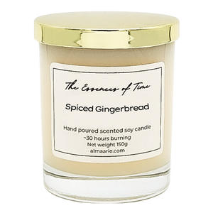 Spiced Gingerbread scented soy candle in a clear glass ar with gold lid.